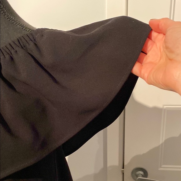 Black Asymmetrical Ruffled Sleeveless Top - Picture 2 of 6